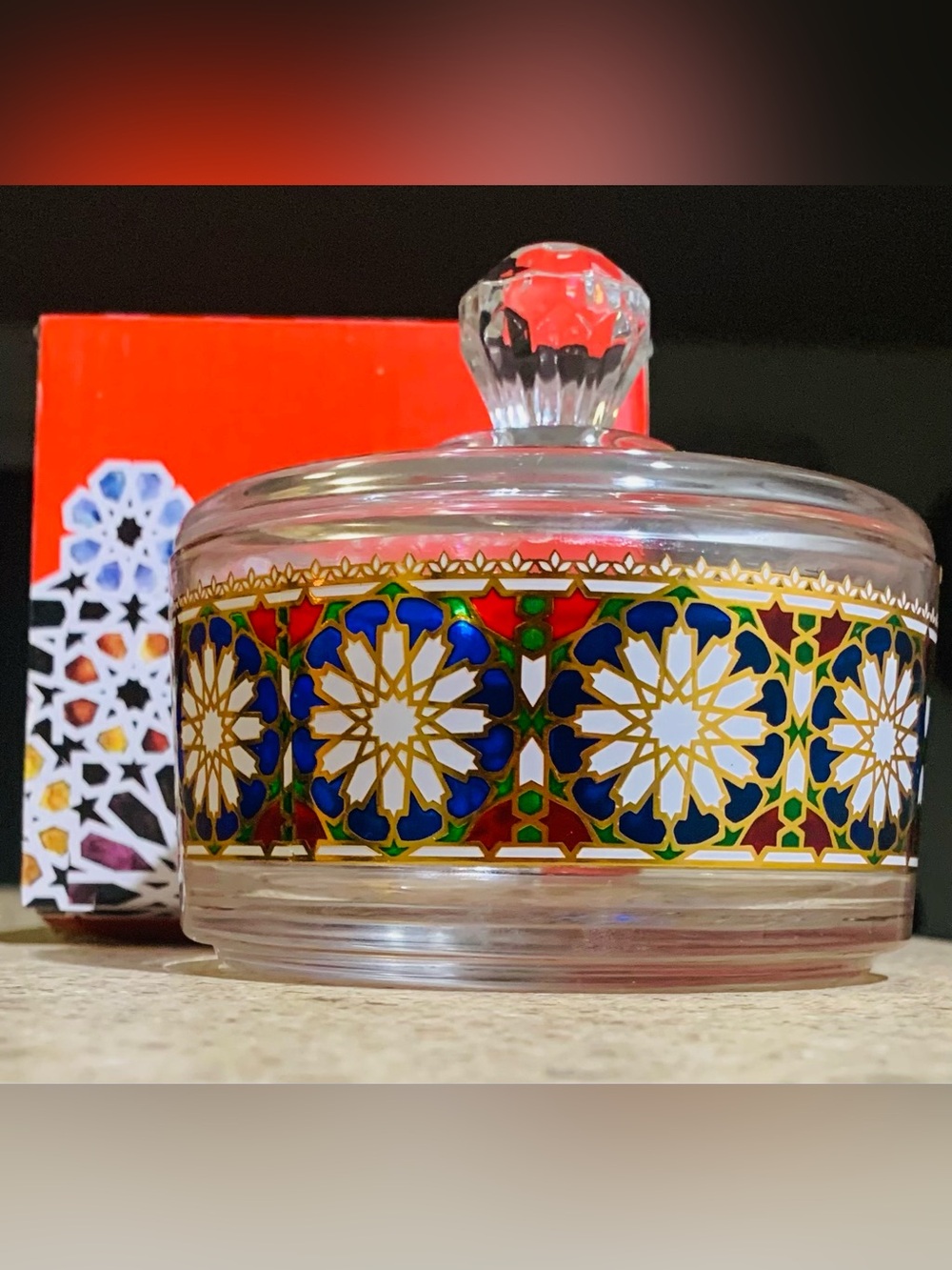 Moroccan glass bowl with lid featuring a traditional oriental, mosaic motif.